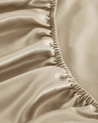 a close up of a beige satin fabric