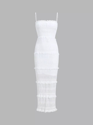 a white dress with fringes on the bottom