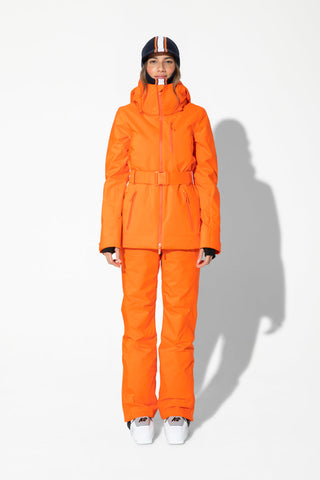 a woman wearing an orange ski suit