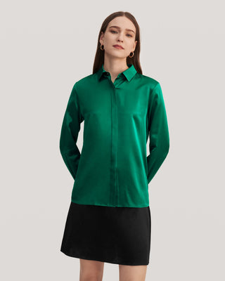 a woman in a green shirt and black skirt