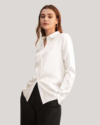 a woman wearing a white shirt and black pants