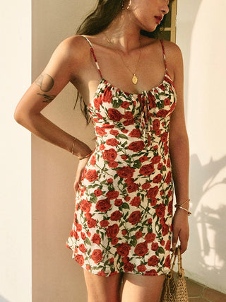 a woman wearing a floral print dress