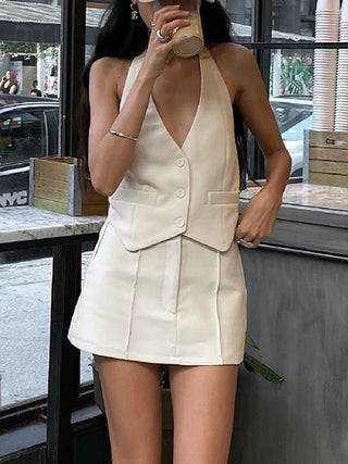 a woman standing in front of a window drinking a drink