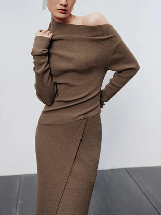 a woman in a brown sweater and skirt