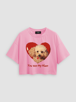 a pink cropped cropped crop top with an image of a dog with a heart on it