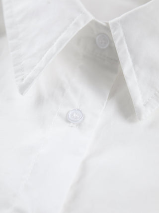 a close up of a white shirt with buttons