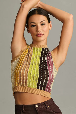 a woman wearing a cropped crop top with a colorful striped pattern