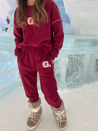 a little girl standing in front of an ice sculpture