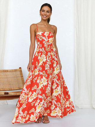 a woman wearing a red and white floral print dress