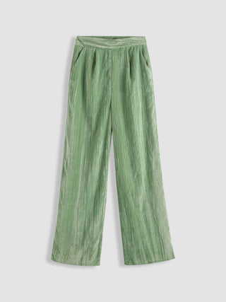 Girl In Green Velvet Trousers