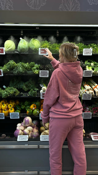 a woman in a pink hoodie