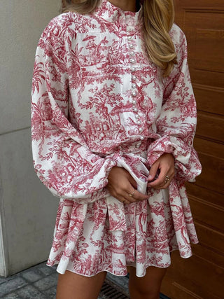 a woman wearing a red and white floral print shirt dress