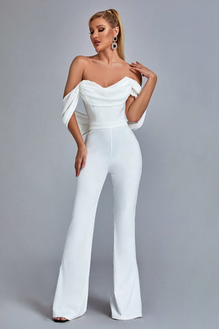 a woman wearing a white jumpsuit