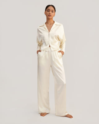 a woman in a white shirt and pants