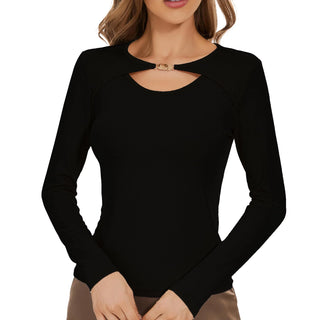 a woman wearing a black top with cut out shoulders