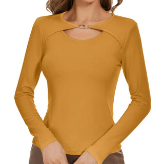 a woman wearing a mustard colored top