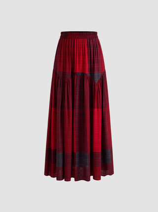 a woman wearing a red and black plaid skirt