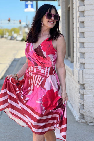 a woman in a pink and red dress