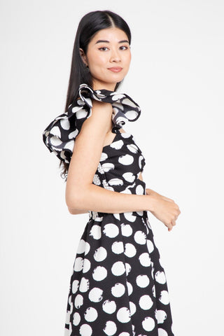 a woman in a black and white dress