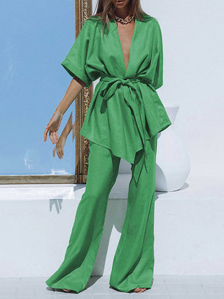 a woman in a green jumpsuit