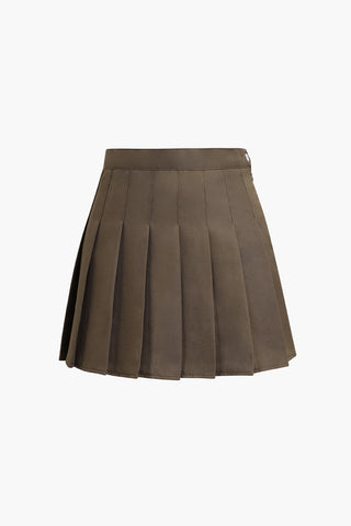 a brown skirt with plea detailing on the bottom