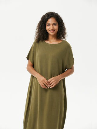 a woman in a green dress