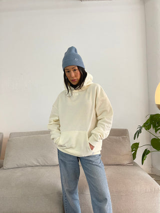 a woman standing on a couch in a living room