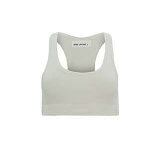 a woman ' s sports bra top in white