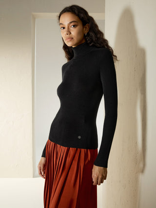 a woman wearing a black turtle neck sweater