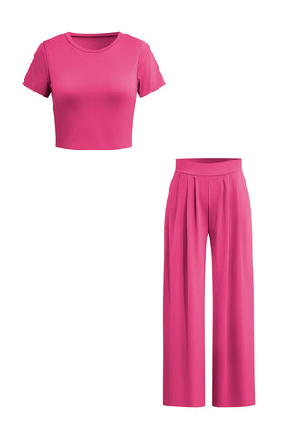 a woman in a pink top and pants