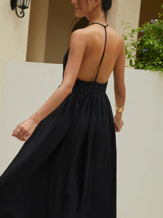 the back of a woman in a black dress