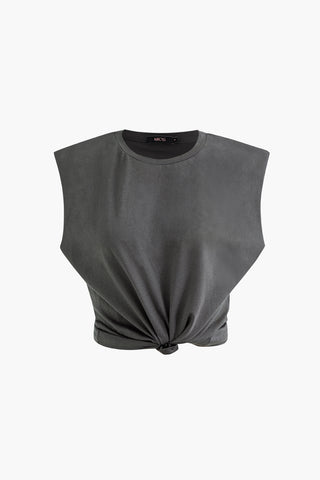 a black crop top with a twist on the front