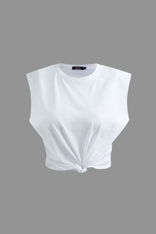 a white crop top with a knot at the front