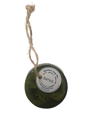 a green soap ball hanging from a rope