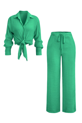 a woman wearing a green shirt and pants