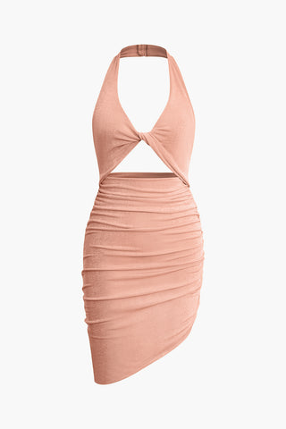 a pink dress with a halt neckline