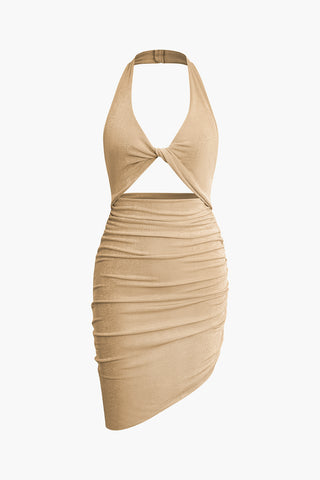 a beige dress with a halt neckline