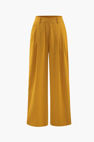 a woman is wearing a mustard colored pants